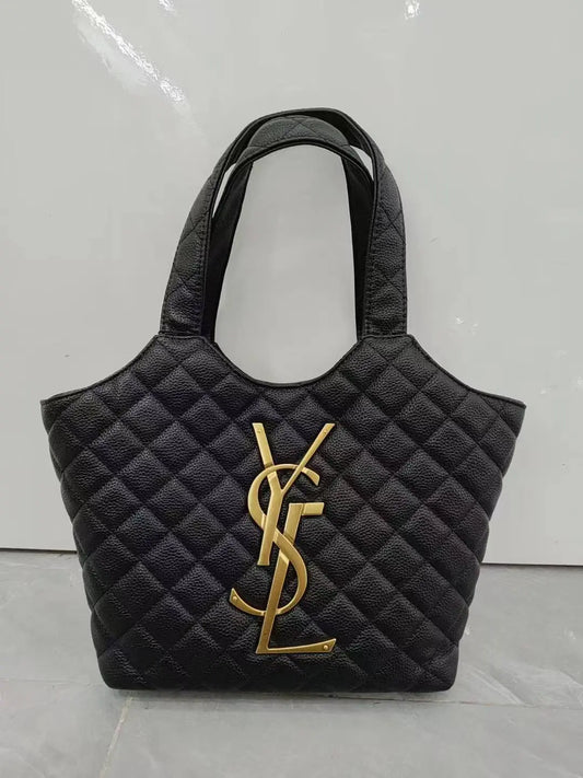Black quilted handbag with gold logo on a light gray background